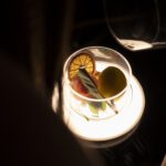 Guest savoring the aroma of red wine during an immersive Tuscan tasting experience.