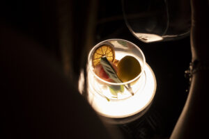 Guest savoring the aroma of red wine during an immersive Tuscan tasting experience.
