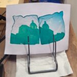 Finished Polaroid emulsion lift transfer of Florence cathedral drying on a stand at Fatacadabra photography workshop