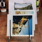 Polaroid photos and emulsion lift transfers of Florence scenes displayed at Fatacadabra photography experience