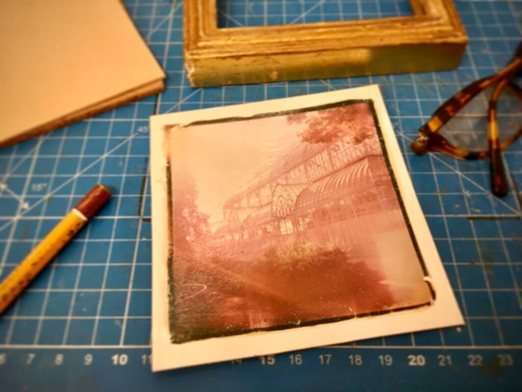 Completed Polaroid emulsion lift print in warm pink tones at the photography experience Florence, Fatacadabra