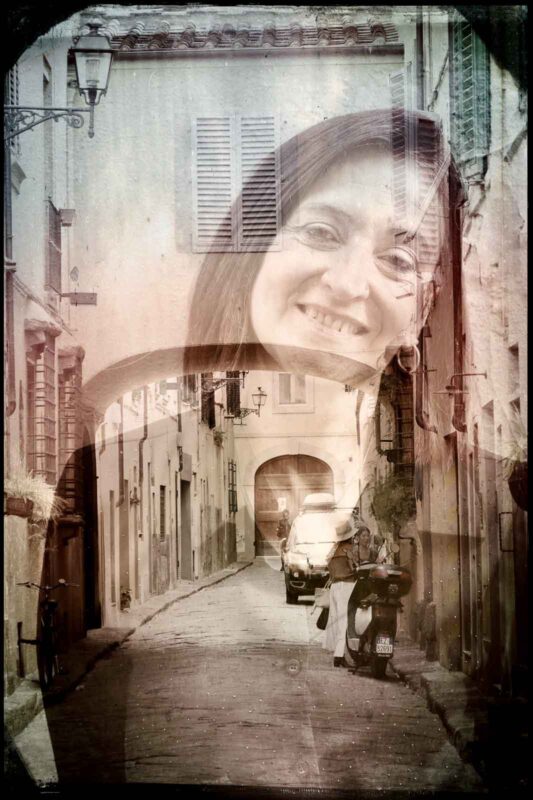Double exposure portrait blending a smiling woman with a Florence alleyway at the double exposure workshop Florence