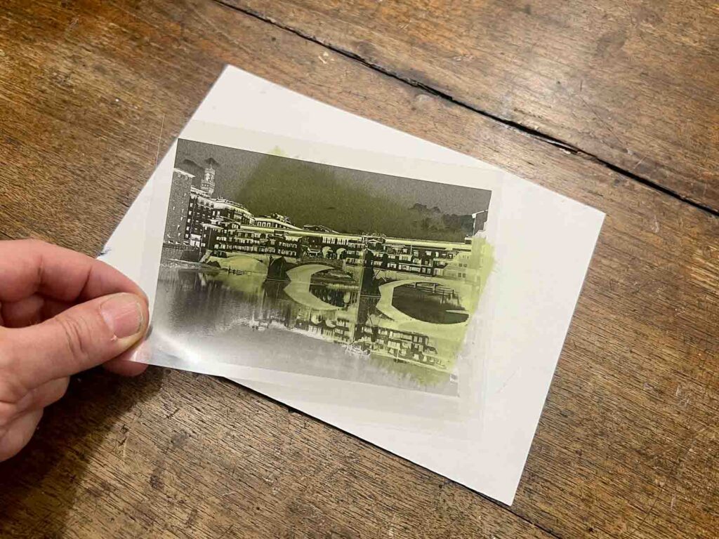 Acetate negative of Ponte Vecchio placed over emulsion-coated paper at a cyanotype printing Florence session