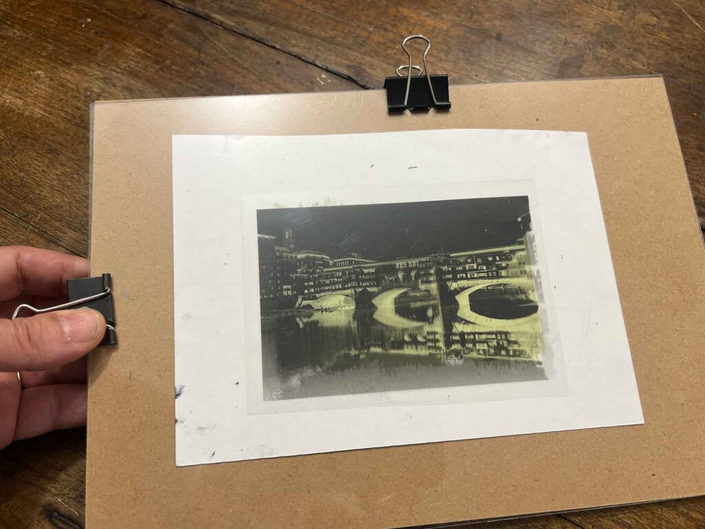 Acetate negative clamped onto coated paper and ready for UV exposure at an art workshop Florence, Fatacadabra