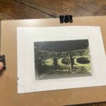 Acetate negative clamped onto coated paper and ready for UV exposure at an art workshop Florence, Fatacadabra