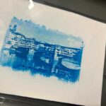 Cyanotype print of Ponte Vecchio developing in water during a photography workshop Florence at Fatacadabra