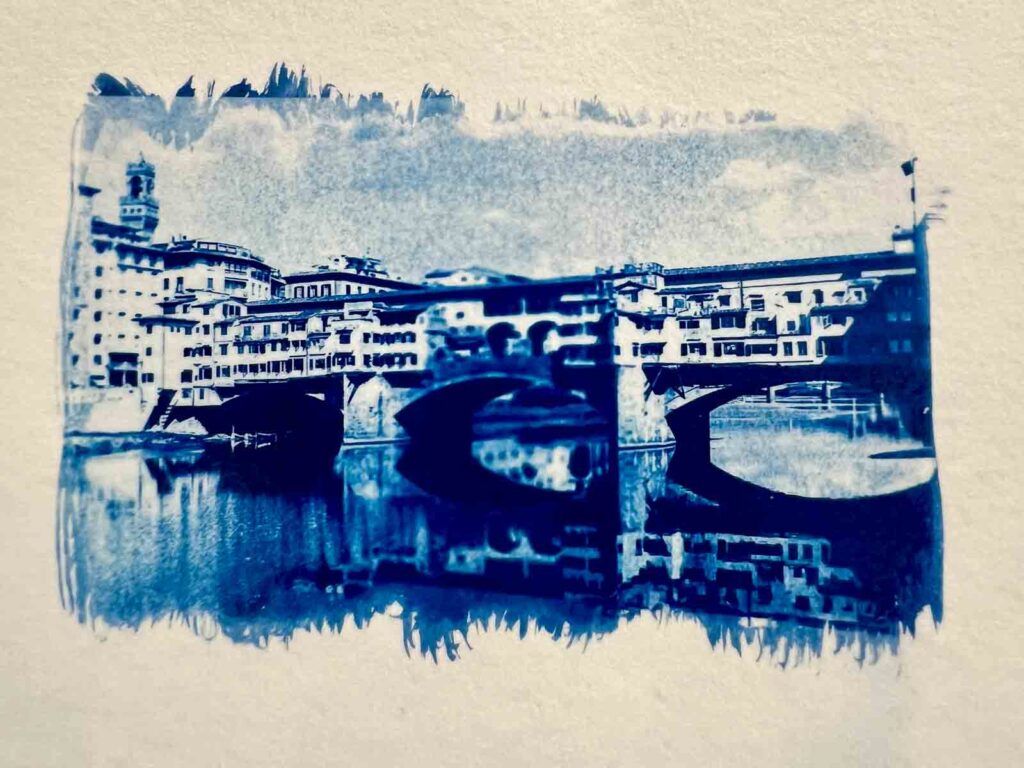 Deep blue cyanotype print of Ponte Vecchio on textured paper, result of the cyanotype workshop Florence