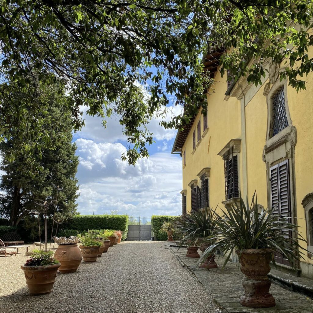 Exterior courtyard of Villa Monteoriolo where guests arrive for a private Tuscan cooking class in Chianti.