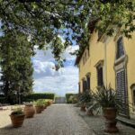 Exterior courtyard of Villa Monteoriolo where guests arrive for a private Tuscan cooking class in Chianti.