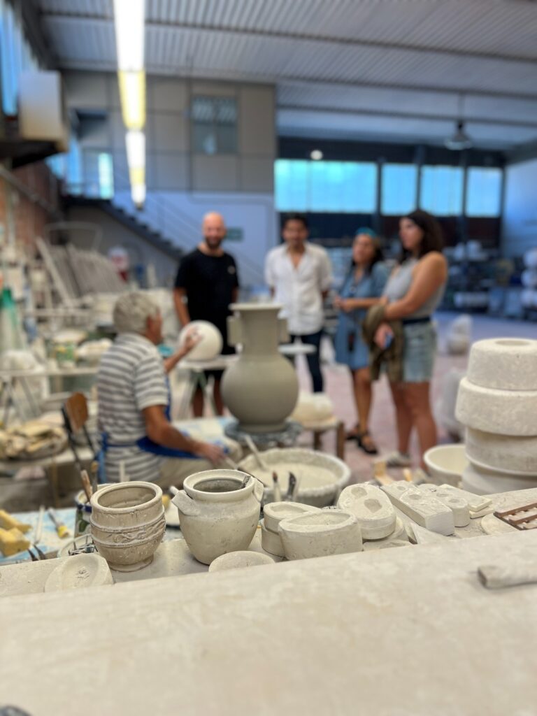 Live pottery demonstration during a ceramics workshop near Florence factory tour