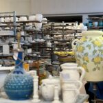 Studio shelves with pottery and materials inside the Montelupo ceramics workshop