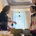 Florence pizza making class in a frescoed historic house with guests cooking